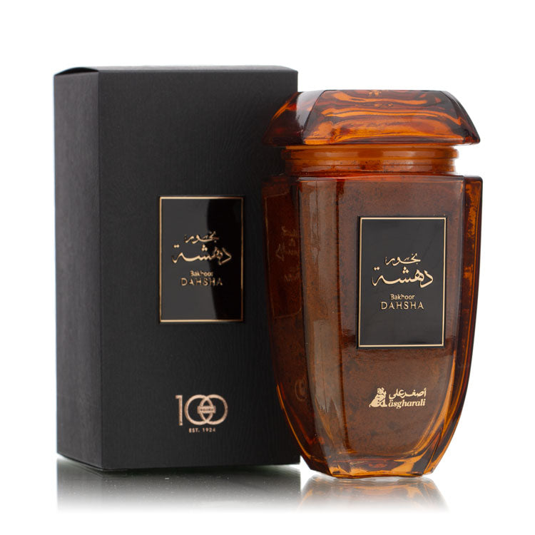 Dahsha Bakhoor 180Grm jar with its outer black and gold packaging box, both placed side by side