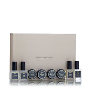 Discover Asgharali gift box open, showcasing four mini perfumes and four bakhoor containers in elegant layout
